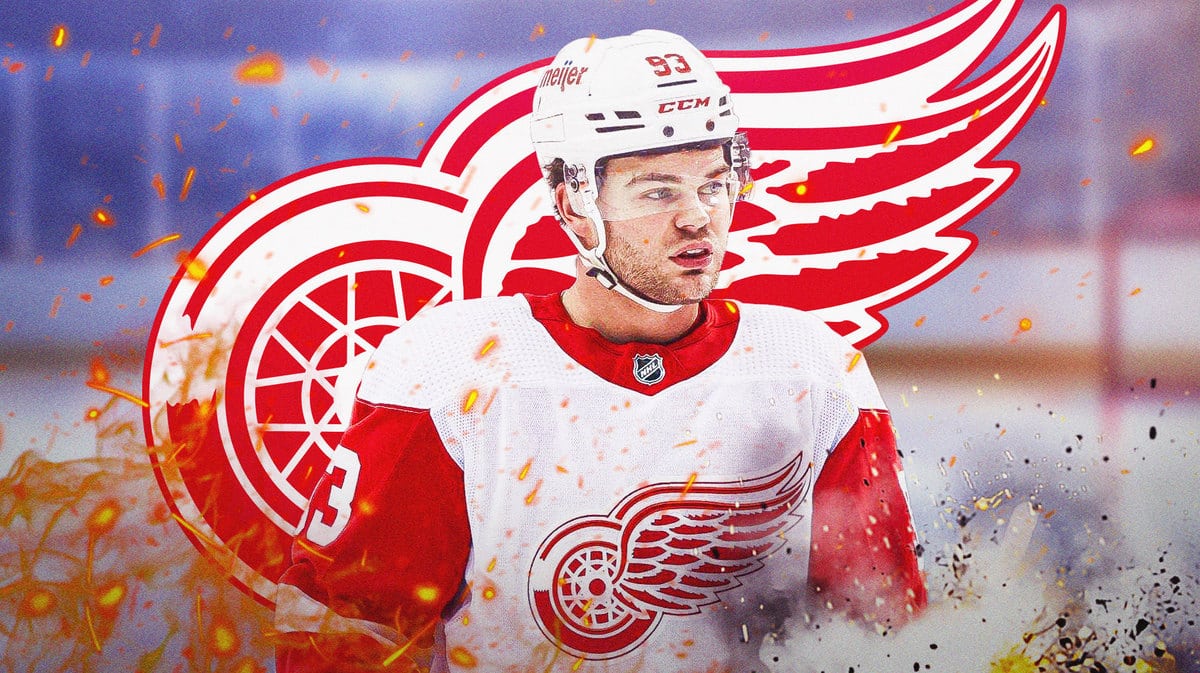 Alex DeBrincat, Detroit Red Wings, hockey rink in background, DeBrincat looking into distance