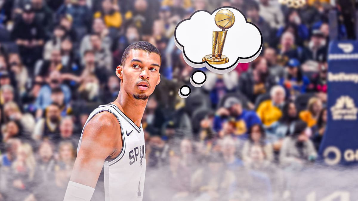 Spurs' Victor Wembanyama with a thought bubble. In the bubble, place the NBA Finals trophy.