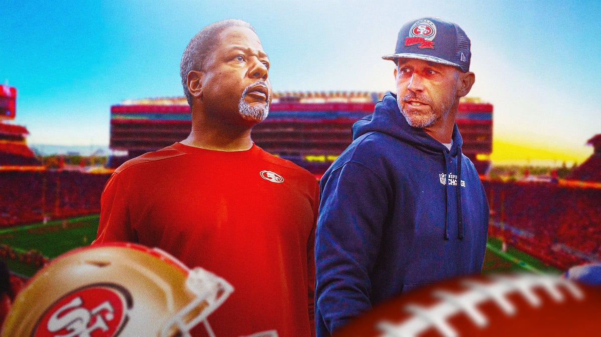 Kyle Shanahan looking angry with Steve Wilks next to him