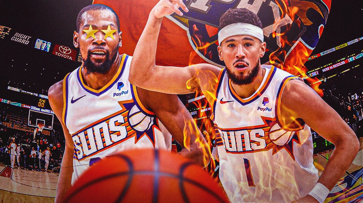 Kevin Durant admiring Devin Booker, who was on fire in the Suns season-opening win over the Warriors