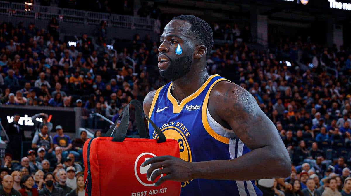 Warriors' Draymond Green with animated tears while holding a first aid kit