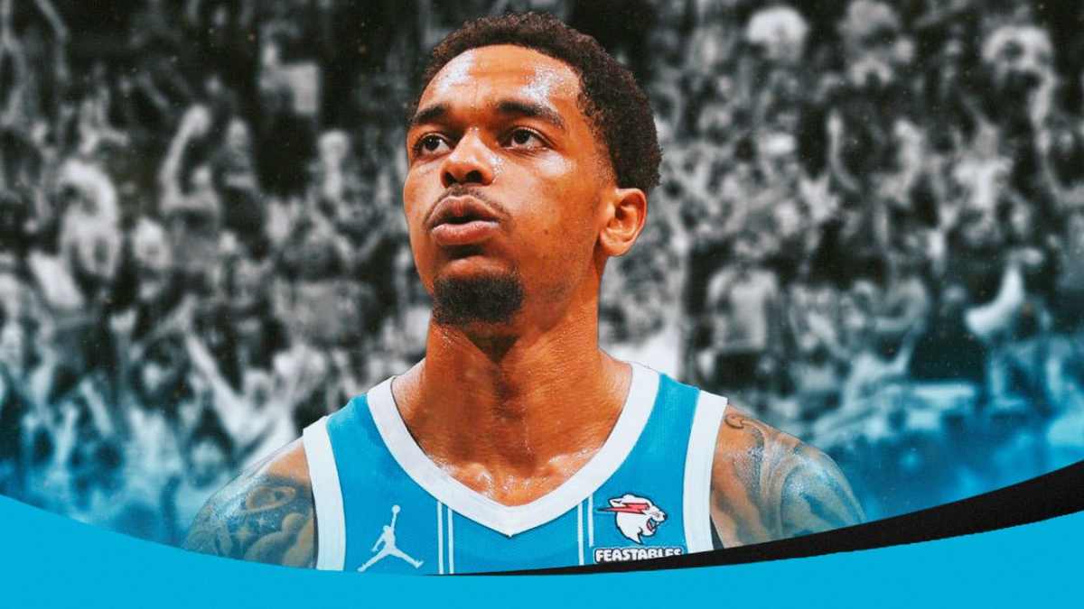 PJ Washington with the Hornets arena in the background