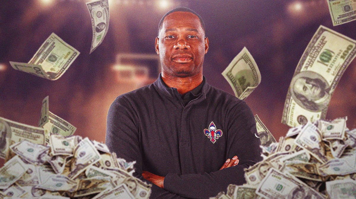 Willie Green surrounded by piles of cash.