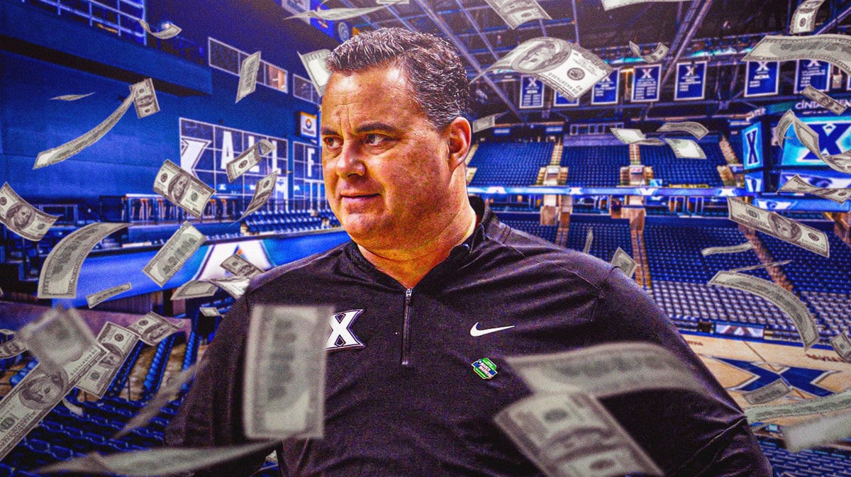 Sean Miller with dollar bills flying around.