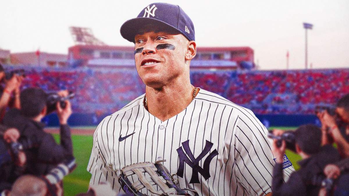 Yankees' Aaron Judge standing on the Fresno State baseball field smiling