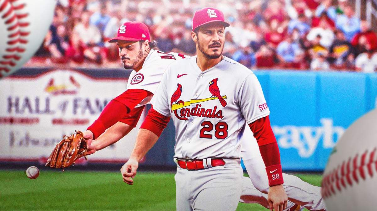 Cardinals' Nolan Arenado diving for a baseball in background. In front, Cardinals' Nolan Arenado looking serious.