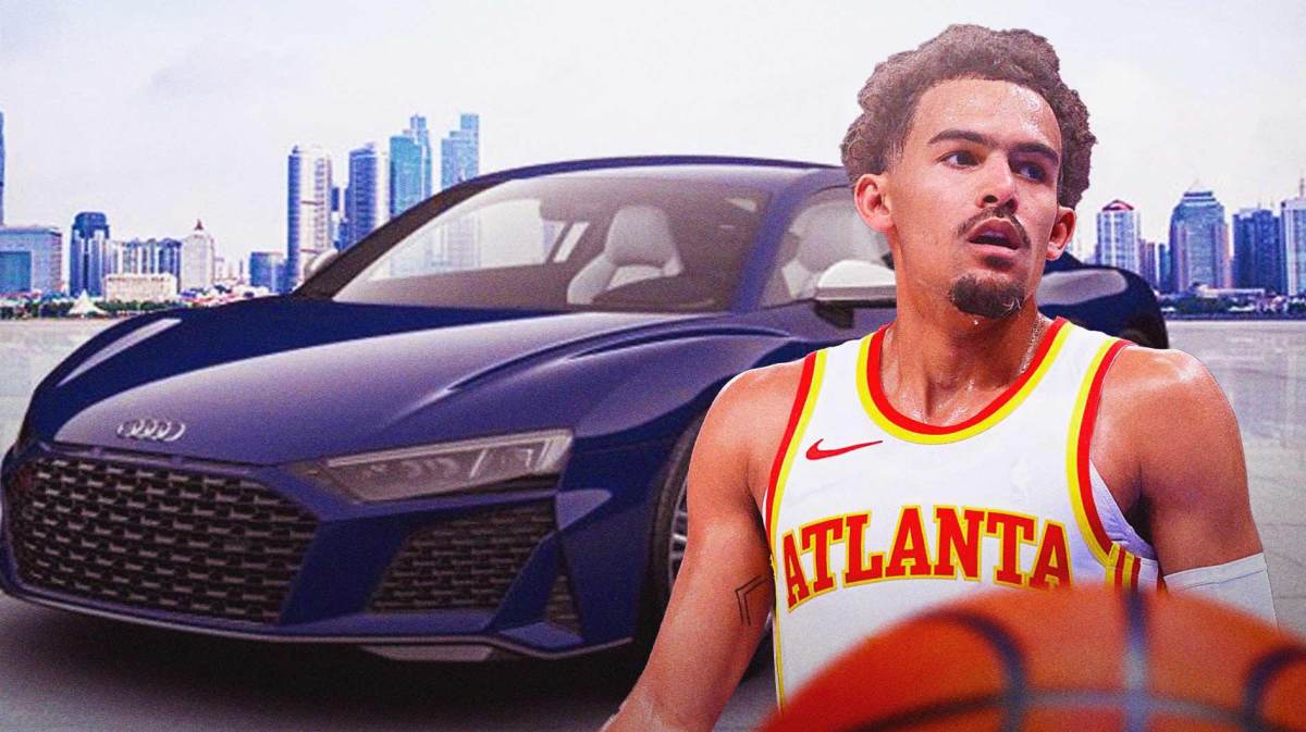 The Atlanta Hawks' Trae Young in front of his Audi R8.
