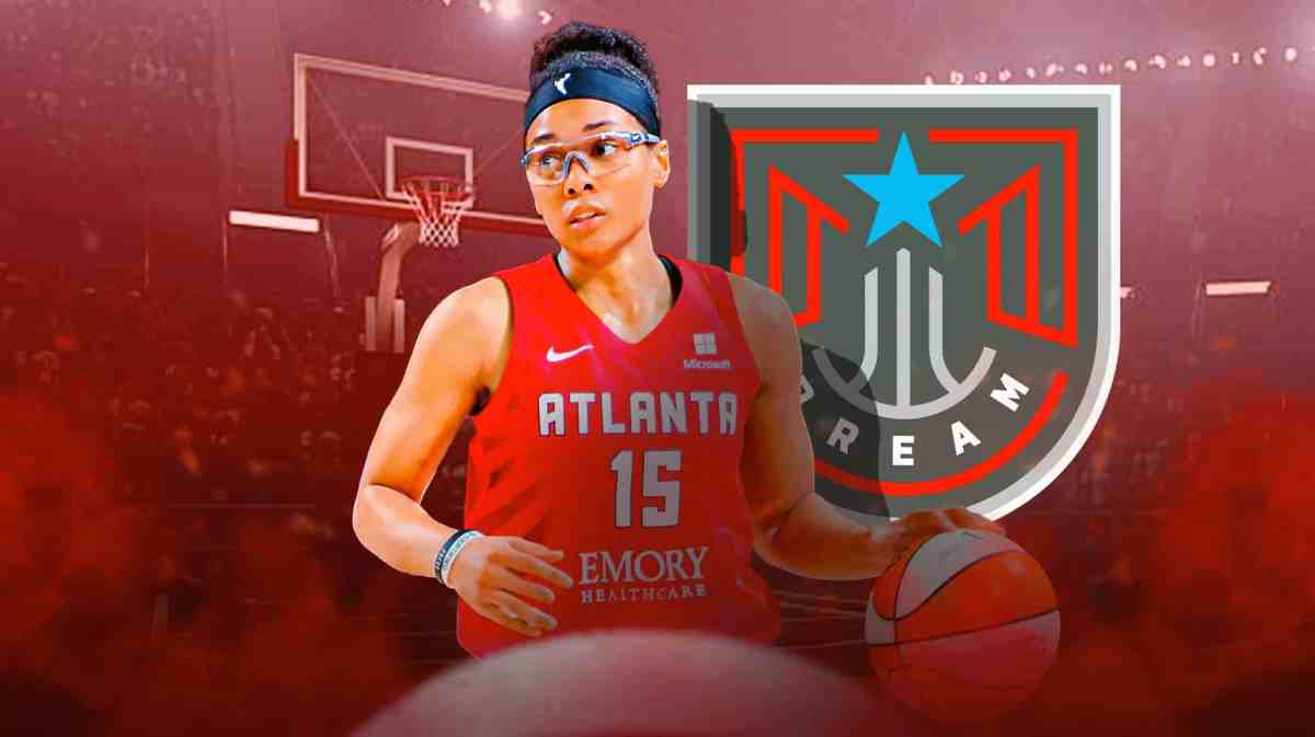 Allisha Gray with the Dream logo in the background