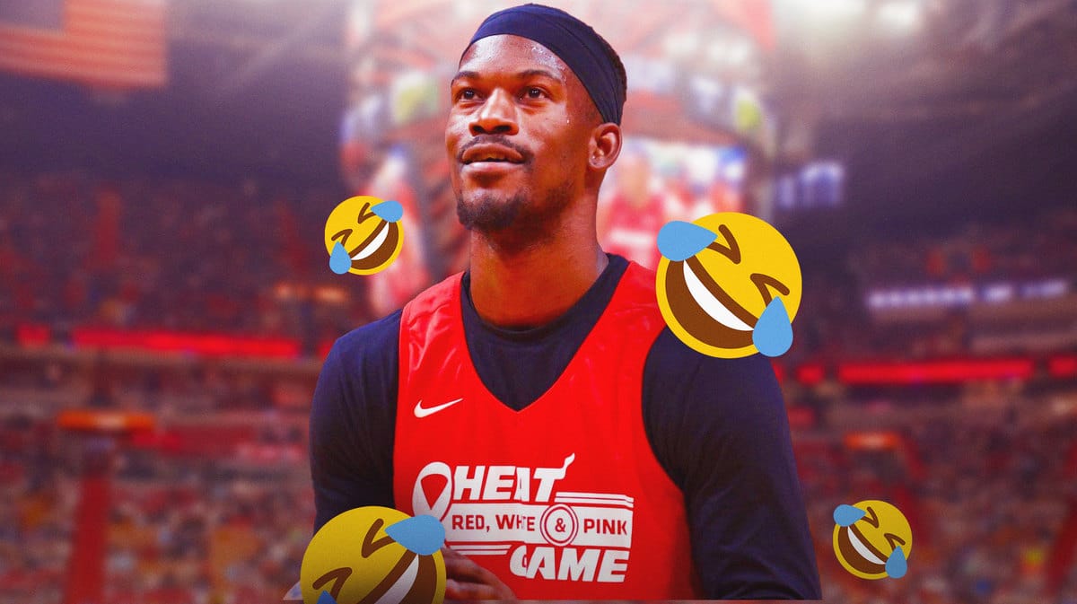 Miami Heat's Jimmy Butler smiling with the Kaseya Center in the background.