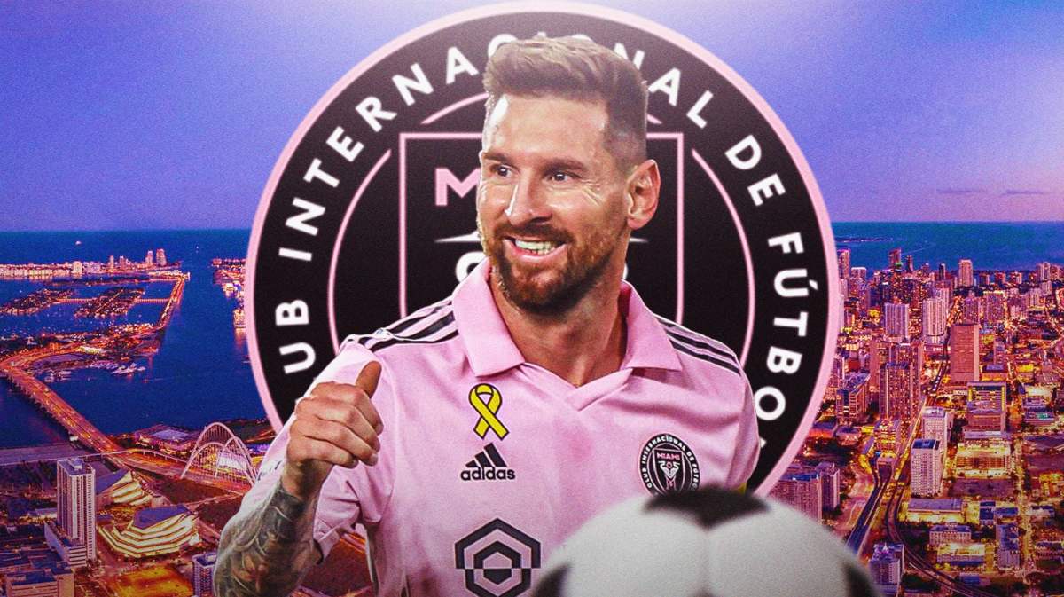 Lionel Messi smiling in front of the Inter Miami logo