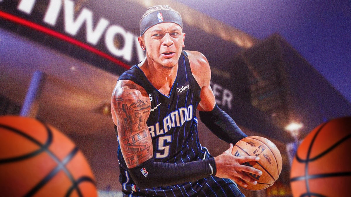 Paolo Banchero going up for a layup with Amway Center in the background