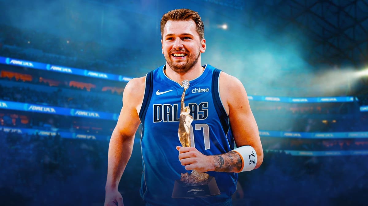 Mavs' Luka Doncic holding the NBA MVP trophy