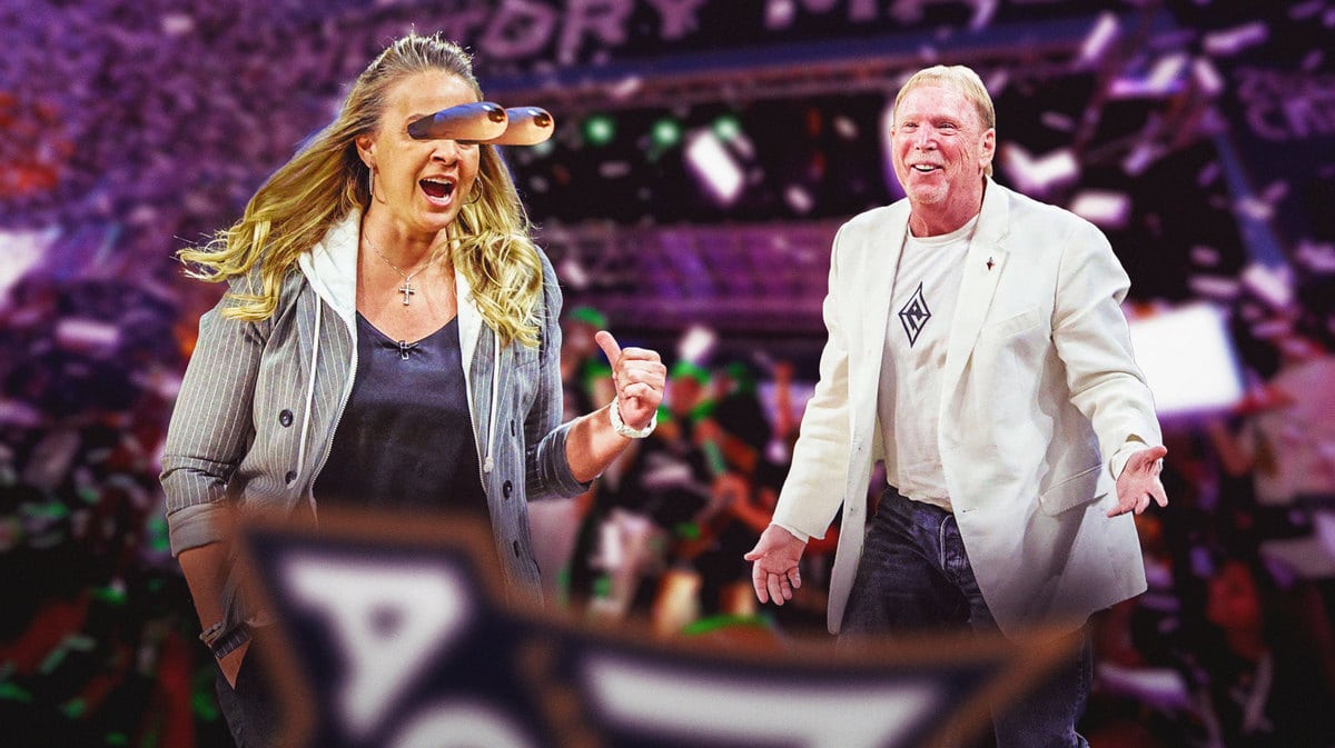 Las Vegas Raiders owner Mark Davis dancing while Las Vegas Aces head coach Becky Hammon looks on.