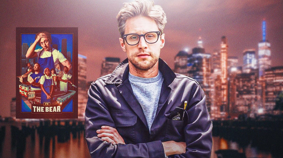 Christopher Storer standing in front of The Bear poster.