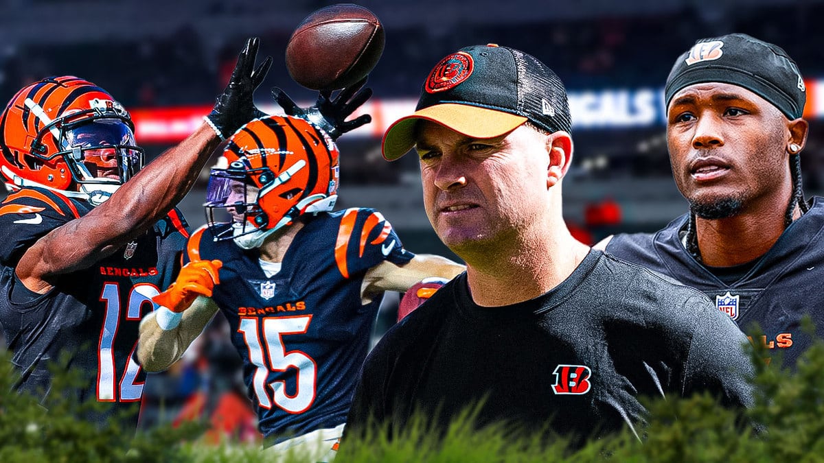 Bengals' Zac Taylor in front. Bengals' Tee Higgins next to him. Bengals' Charlie Jones and Bengals' Shedrick Jackson in background catching footballs.