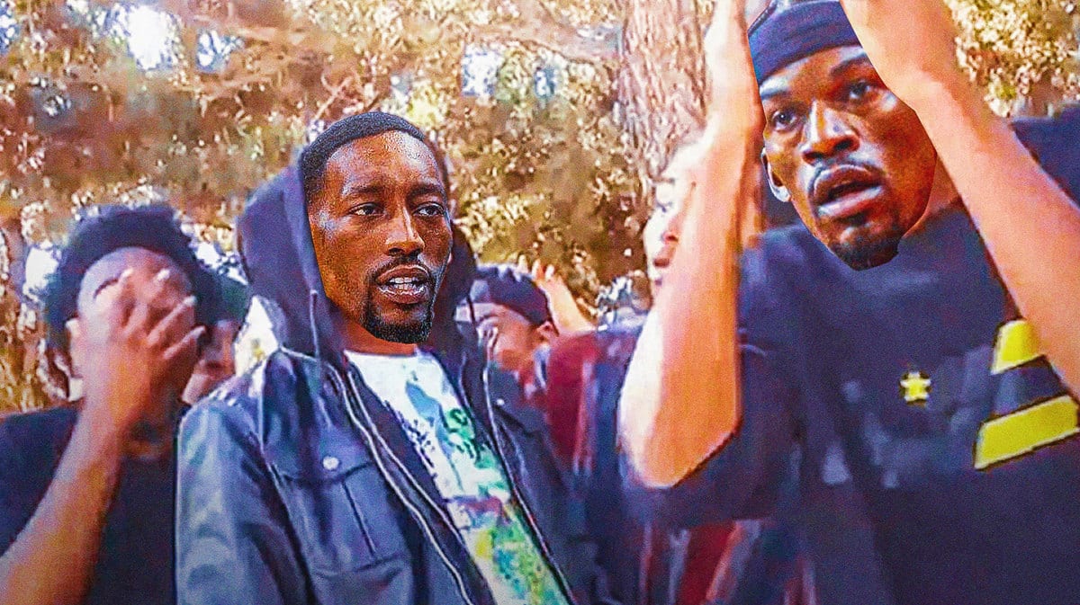 Bam Adebayo of the Heat as the guy in the hoodie and Jimmy Butler as the guy on the right with his hands on his face
