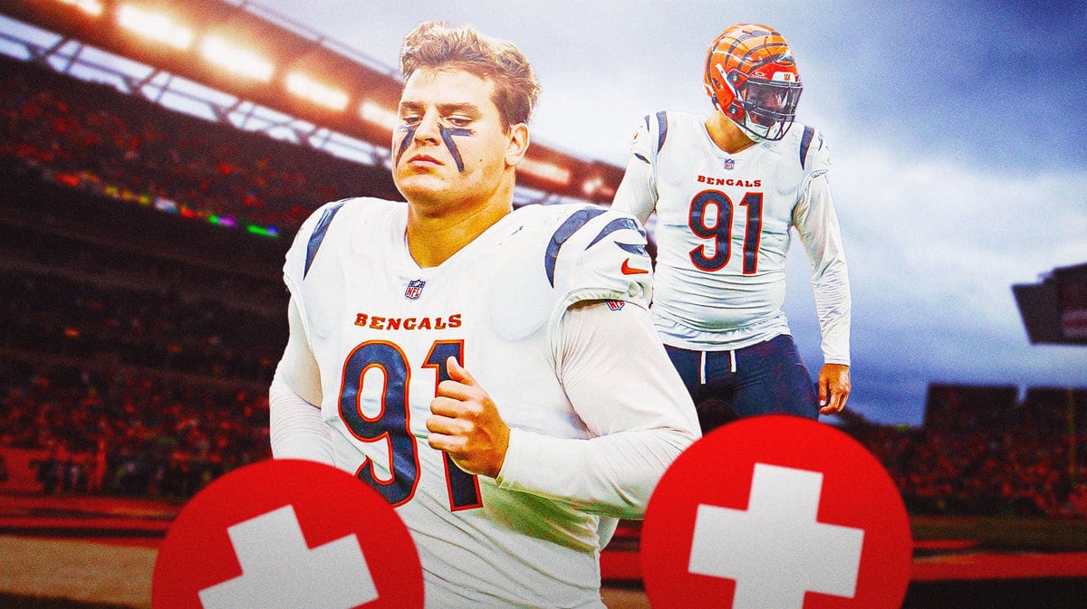 Action shot of Trey Hendrickson of the Bengals with medical cross symbol