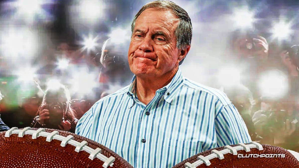 Bill Belichick with cameras flashing around him