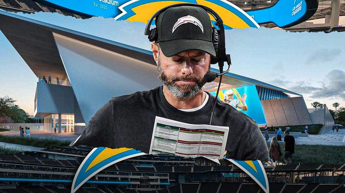 Brandon Staley looking disappointed with the Chargers logo in the background