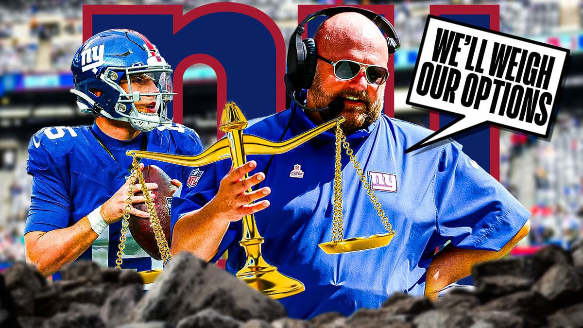 Giants QB Tommy DeVito and Brian Daboll holding a scale