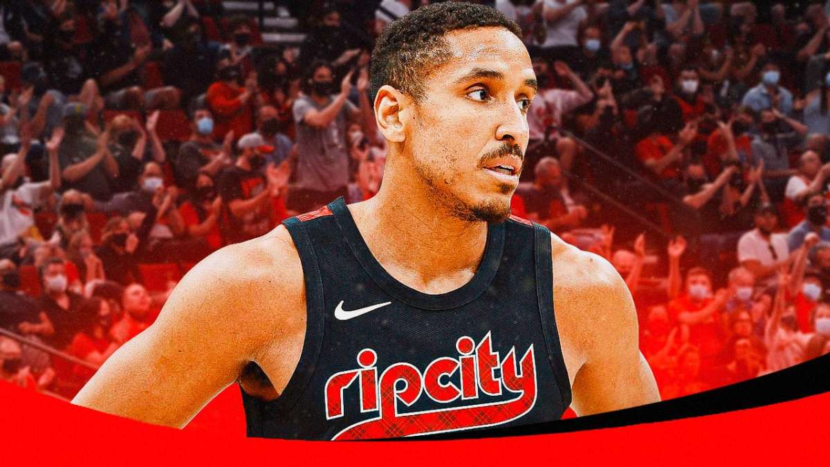 Malcolm Brogdon with the Blazers arena in the background