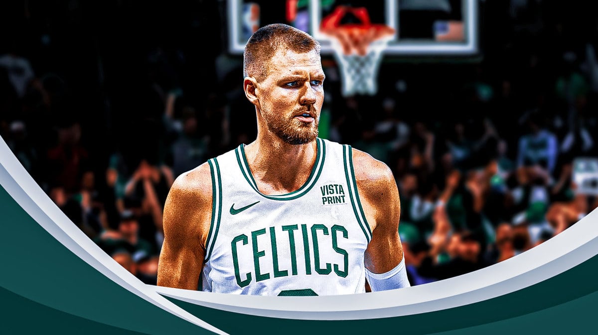 Kristaps Porzingis (celtics jersey) looking serious on a TD Garden background