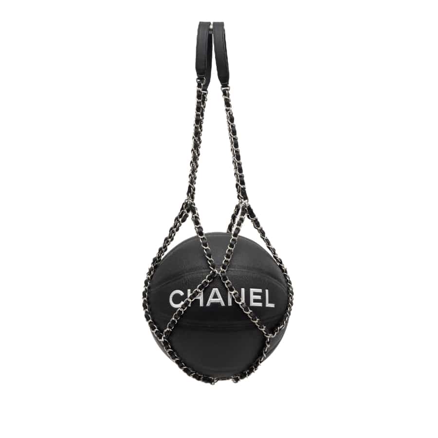 Chanel basketball bag:  Black basketball and silver chain net on a white background.