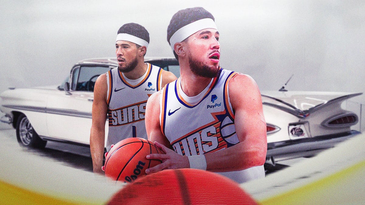 The Phoenix Suns' Devin Booker in front of one of the cars in his collection.