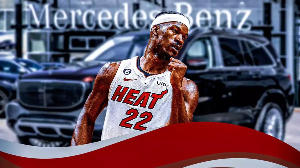 Jimmy Butler in front of a car from his collection.