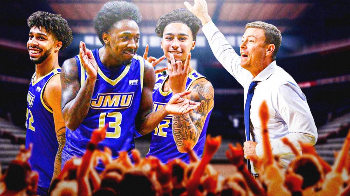 James Madison coach Mark Byington on the right with James Madison players celebrating on the left.