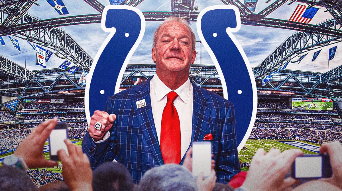 Photo: Jim Irsay with suit and Colts logo behind him