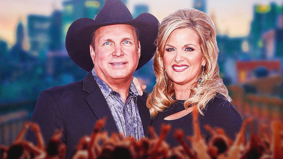 Garth Brooks and Trisha Yearwood in front of fans.