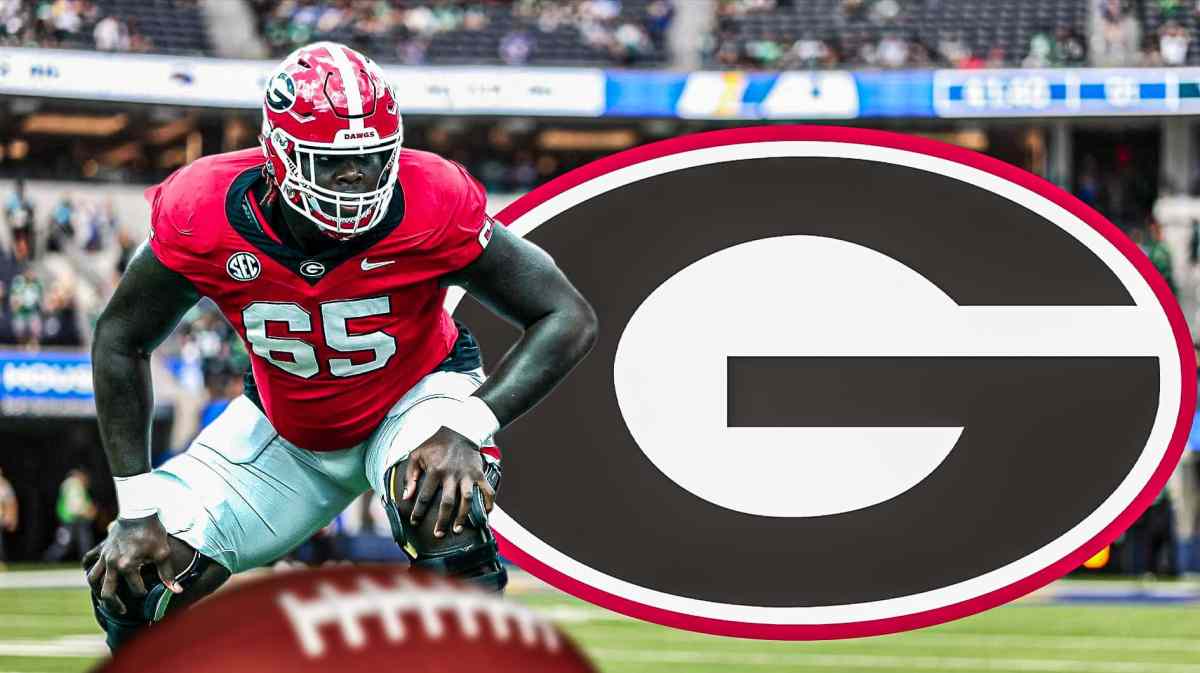Georgia offensive lineman Amarius Mims on the left in the foreground, with a Georgia logo on the right.