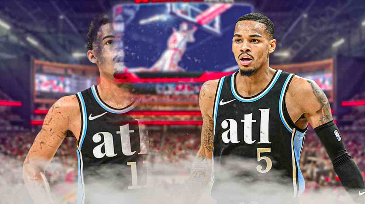 Atlanta Hawks guard Trae Young disappearing on the left of the foreground. Another Hawks player on the right in foreground.