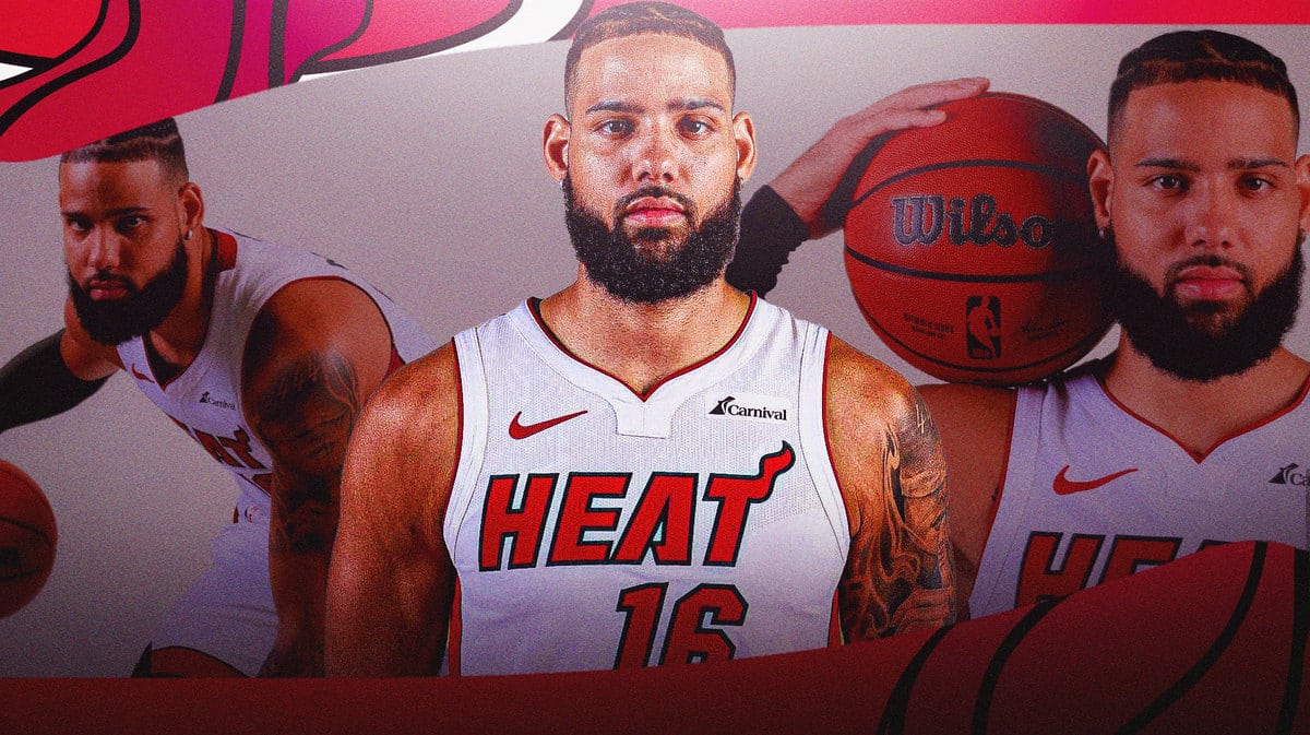 Miami Heat forward Caleb Martin next to pictures of himself.