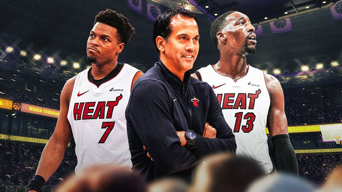 Miami Heat head coach Erik Spoelstra next to Kyle Lowry and Bam Adebayo.
