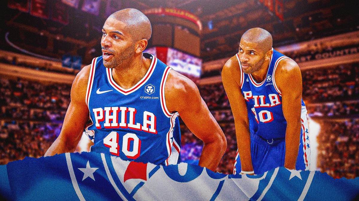 Nicolas Batum in his Sixers jersey with the Sixers arena in the background
