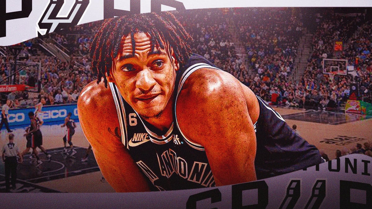 Devin Vassell with the Spurs arena in the background injury