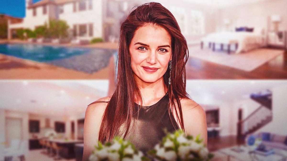 Katie Holmes smiling in front of any photo from the slideshow in this article
