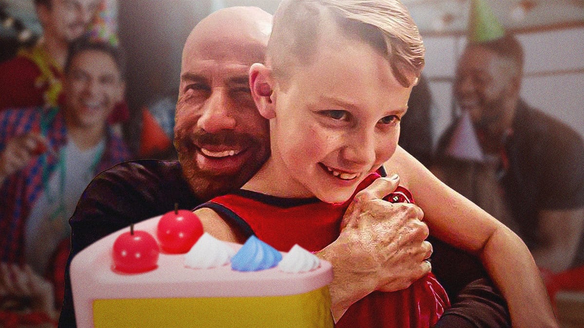 John Travolta with his son Benjamin and a birthday cake.