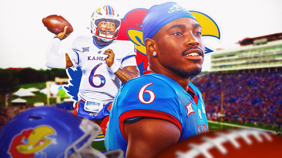 Kansas football’s Jalon Daniels throwing a football with the Kansas football logo in background