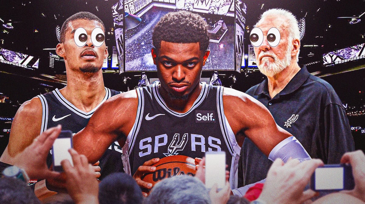 Spurs' Keldon Johnson surrounded by Victor Wembanyama and Gregg Popovich