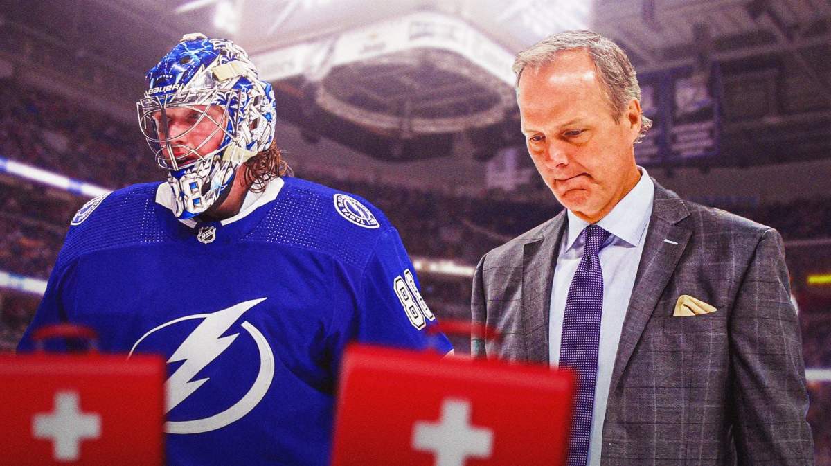 Andrei Vasilevskiy in Lightning jersey, Jon Cooper beside him coaching the Lightning