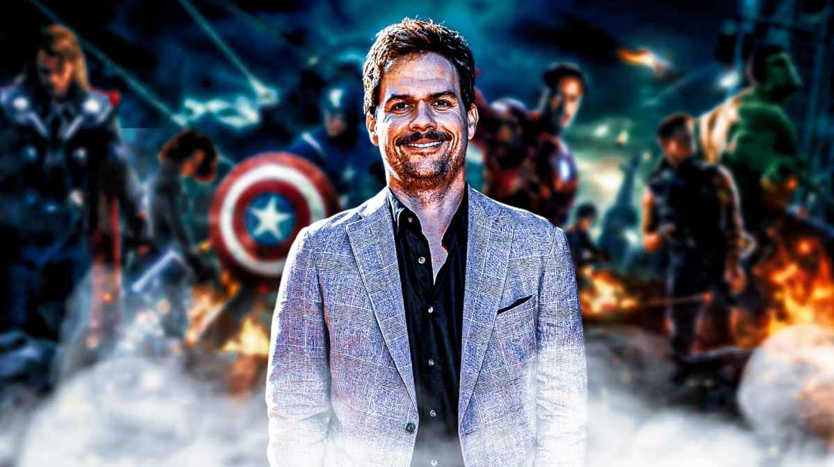 Loki creator Michael Waldron with Avengers in the background.