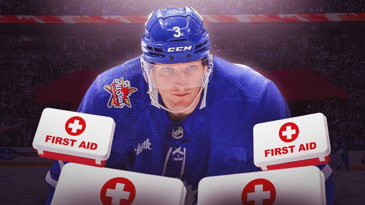 John Klingberg in action in Maple Leafs jersey with medical kits around him