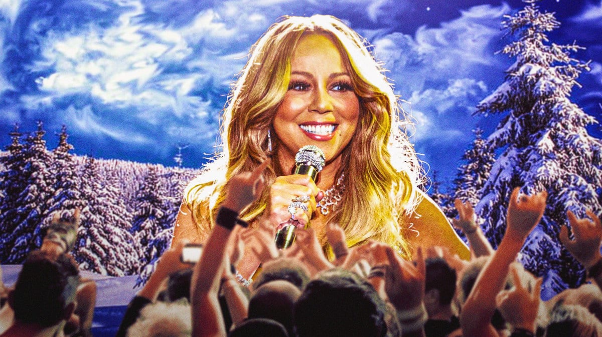 Mariah Carey with wintery trees in the background.