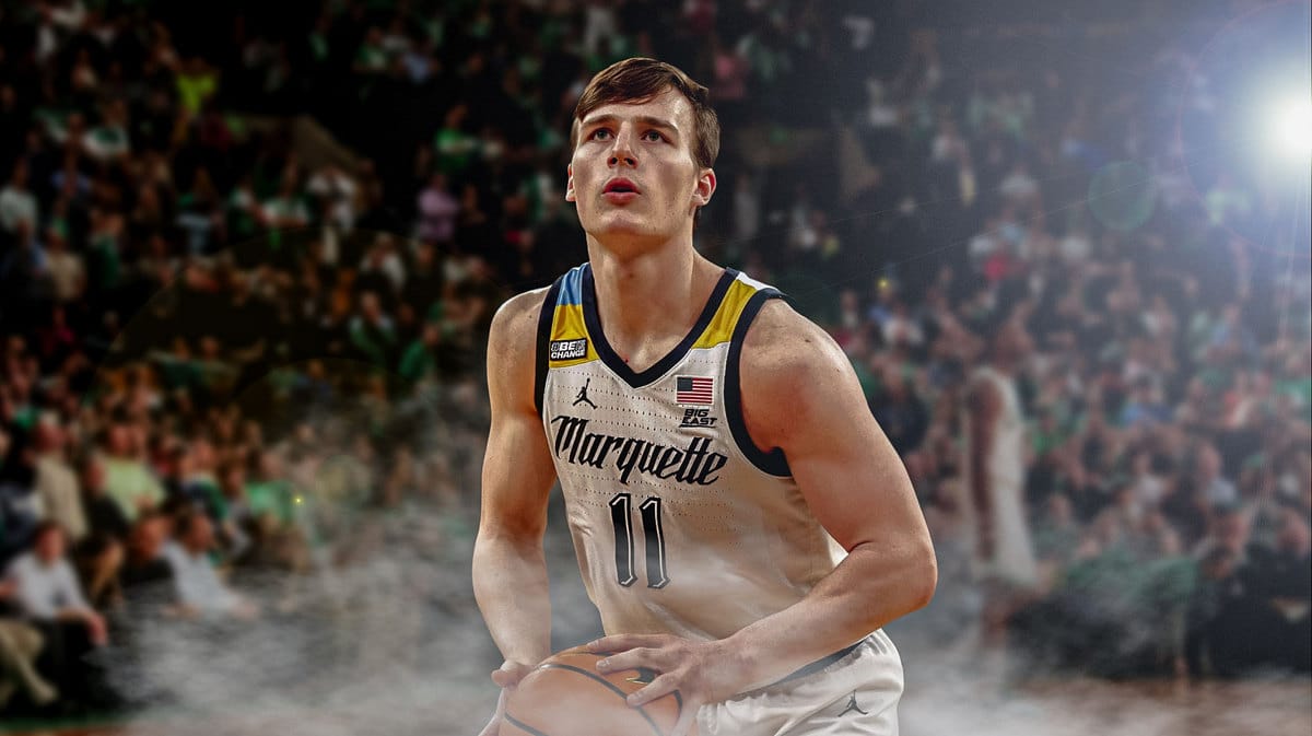Tyler Kolek shooting a basketball in a Marquette uniform