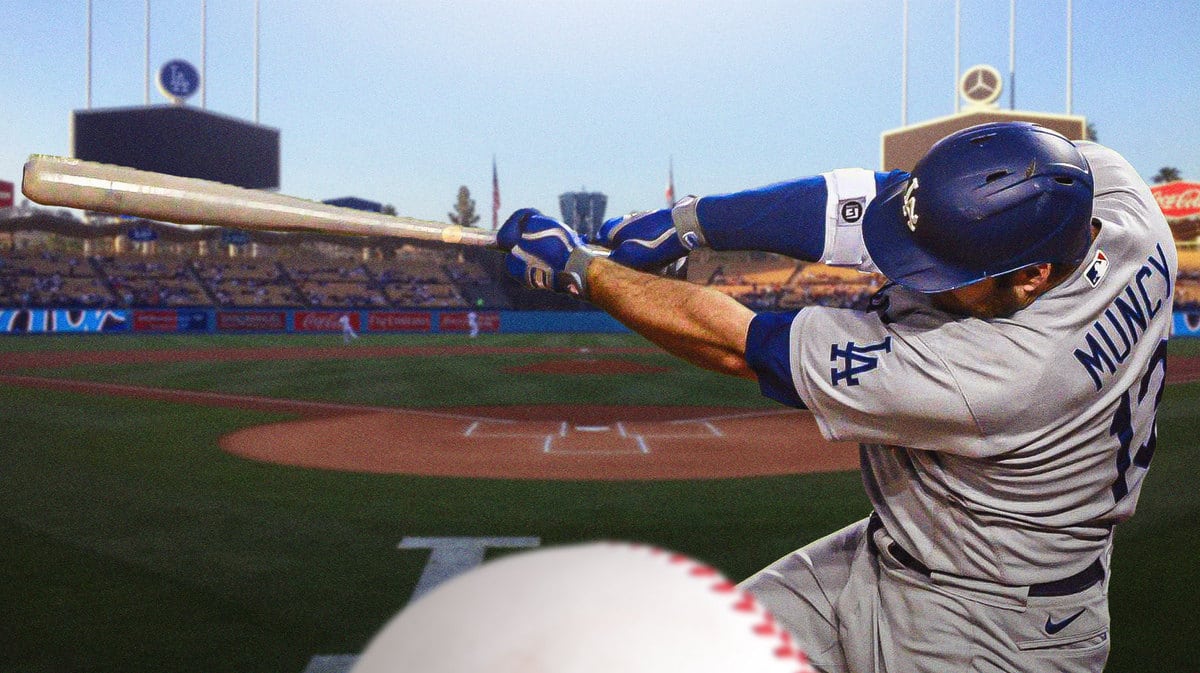 Dodgers' Max Muncy swinging a baseball bat at Dodger Stadium
