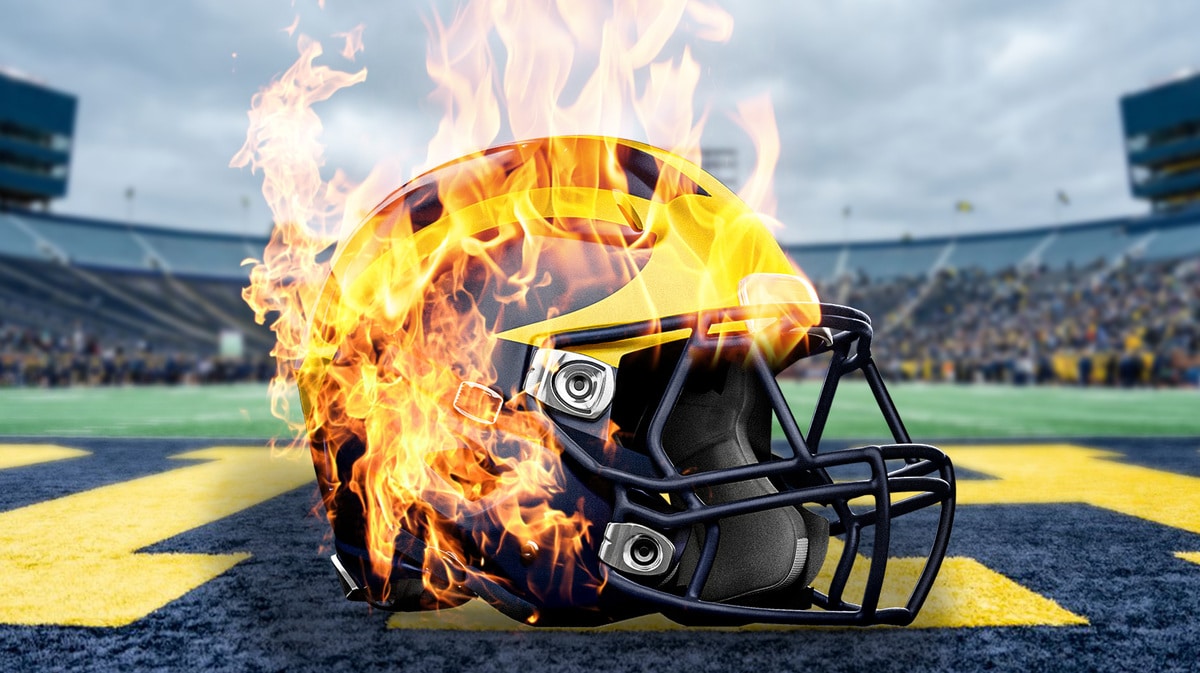 Michigan football helmet engulfed in flames