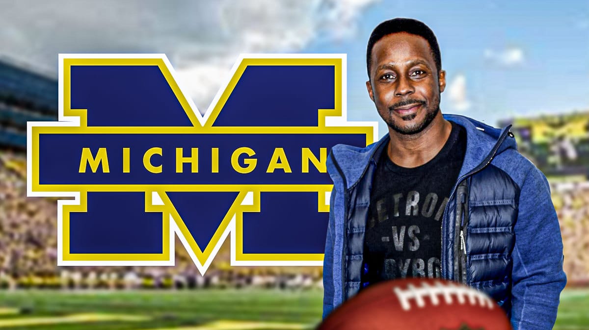 Analyst Desmond Howard and the Michigan Football logo in front of their stadium in Ann Arbor, Michigan.
